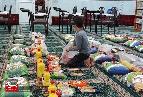 تهیه و توزیع 80 بسته کمک معیشتی و 300 جفت کفش در بین خانواده های آبرومند