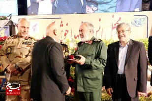 از خانواده شهدای یگان حفاظت سپاه فرودگاه مشهد تجلیل شد + عکس