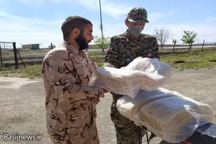 توزیع نان نذری در روستاهای بخش تجرک