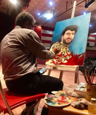خلق تابلوی نقاشی شهید مدافع حرم علی منیعات در خرمشهر